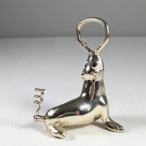 Vintage metal sea lion bottle opener and corkscrew